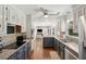 Well-lit kitchen featuring granite countertops and stainless steel appliances at 667 Shortwood St, Charleston, SC 29412