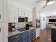 Bright kitchen featuring granite counters, an electric stovetop, and modern appliances at 667 Shortwood St, Charleston, SC 29412