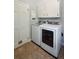 Functional laundry room with modern, front-loading washer and dryer, plus ample storage cabinets at 667 Shortwood St, Charleston, SC 29412