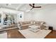 Open-concept living room and eat-in kitchen with hardwood floors and modern decor at 667 Shortwood St, Charleston, SC 29412