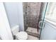 Modern bathroom boasts a tiled shower with glass door and a toilet at 7655 Ovaldale Dr, North Charleston, SC 29418