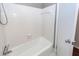 Bright bathroom featuring a clean white bathtub with tiled walls and new fixtures at 7655 Ovaldale Dr, North Charleston, SC 29418