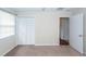 Bedroom with closet and a view to another room with wooden floors at 7655 Ovaldale Dr, North Charleston, SC 29418