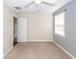 Neutral carpeted bedroom with ceiling fan and doorway at 7655 Ovaldale Dr, North Charleston, SC 29418