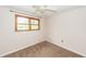 Comfortable bedroom with a ceiling fan and a window offering natural light at 7655 Ovaldale Dr, North Charleston, SC 29418