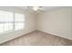 Bright bedroom with neutral carpeting, a ceiling fan, and natural light from the windows at 7655 Ovaldale Dr, North Charleston, SC 29418