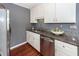 Updated kitchen featuring stainless steel appliances, granite countertops, and white cabinets at 7655 Ovaldale Dr, North Charleston, SC 29418