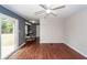 Open living space featuring wood-look floors, access to the yard, and a dining area for flexible living at 7655 Ovaldale Dr, North Charleston, SC 29418