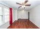 Bright living room with wood-look flooring, large windows, and a ceiling fan for comfortable living at 7655 Ovaldale Dr, North Charleston, SC 29418