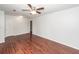 Spacious living room with wood-look flooring, large windows, and convenient closet for storage at 7655 Ovaldale Dr, North Charleston, SC 29418