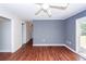 Spacious living room with laminate floors and access to the backyard through a sliding door at 7655 Ovaldale Dr, North Charleston, SC 29418