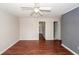 Inviting living room featuring light-colored walls, laminate flooring, and a ceiling fan at 7655 Ovaldale Dr, North Charleston, SC 29418