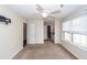 Comfortable main bedroom with plush carpeting, a ceiling fan, and an ensuite bathroom at 7655 Ovaldale Dr, North Charleston, SC 29418