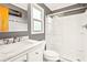 Bathroom featuring a glass enclosed shower, modern vanity with marble countertop, and a window for natural light at 7897 Russell Creek Dr, Edisto Island, SC 29438