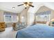 Bright bedroom featuring vaulted ceilings, a ceiling fan, and shuttered windows at 7897 Russell Creek Dr, Edisto Island, SC 29438