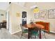 Cozy dining room with a round table, ornate chairs, and elegant overhead lighting fixture at 7897 Russell Creek Dr, Edisto Island, SC 29438