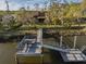Picturesque waterfront home featuring a private dock, boat lift, and scenic views at 7897 Russell Creek Dr, Edisto Island, SC 29438
