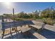 Wooden dock features bench seating, table and views of the river and boat dock at 7897 Russell Creek Dr, Edisto Island, SC 29438