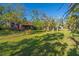 Expansive backyard featuring mature trees, beautiful landscaping, and a charming home at 7897 Russell Creek Dr, Edisto Island, SC 29438