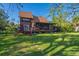Charming home with well-maintained lawn, mature trees and covered deck for outdoor enjoyment at 7897 Russell Creek Dr, Edisto Island, SC 29438