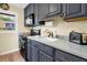 Kitchen featuring stainless steel appliances, modern countertops, and ample cabinet space for storage and food preparation at 7897 Russell Creek Dr, Edisto Island, SC 29438