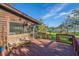 Outdoor deck showcases views of lawn, private waterway, and the pier with bench seating at 7897 Russell Creek Dr, Edisto Island, SC 29438