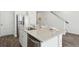 Kitchen island features stainless dishwasher, granite counter and seating at 5577 Ruby Falls Dr, North Charleston, SC 29420