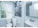 Stylish bathroom with a modern vanity, desert art, and a bright window at 9 Bogard St # 3, Charleston, SC 29403