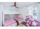 Bright bedroom with bunk beds, ceiling fan, and a window with natural light at 9 Bogard St # 3, Charleston, SC 29403