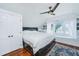 Cozy bedroom featuring a ceiling fan, hardwood floors, and a window with a view at 9 Bogard St # 3, Charleston, SC 29403