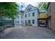 Charming two-story home with a gravel driveway and a covered parking area at 9 Bogard St # 3, Charleston, SC 29403