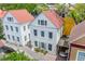Attractive house with a red roof, adjacent to a covered parking area with a sports car at 9 Bogard St # 3, Charleston, SC 29403