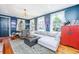 Comfortable living room features a plush sectional, wingback chair, and hardwood floors at 9 Bogard St # 3, Charleston, SC 29403