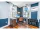 Bright home office space with built-in desk, hardwood floors, and abundant natural light at 9 Bogard St # 3, Charleston, SC 29403