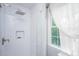 Modern shower featuring white subway tile, glass door, and a convenient built-in niche at 9 Bogard St # 3, Charleston, SC 29403