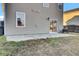 A concrete patio extends from the house, providing a perfect spot for outdoor seating and relaxation at 9676 Godwin St, Ladson, SC 29456