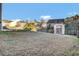 Spacious backyard with a storage shed and a wooden fence for added privacy and security at 9676 Godwin St, Ladson, SC 29456
