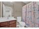 Bathroom featuring a shower with a seashell-themed shower curtain and vanity at 9676 Godwin St, Ladson, SC 29456