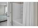 Bathroom featuring a white shower tub with sliding doors and a white shower curtain at 9676 Godwin St, Ladson, SC 29456