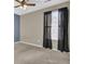 Bedroom with carpet, natural light, and dark curtains at 9676 Godwin St, Ladson, SC 29456