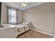 Bedroom featuring hardwood floors, a ceiling fan, a bed, and natural light at 9676 Godwin St, Ladson, SC 29456
