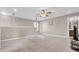 Bright bonus room features neutral walls, carpet, and ceiling fan at 9676 Godwin St, Ladson, SC 29456