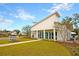 Beautiful clubhouse featuring white siding, large windows, and well-manicured landscaping at 9676 Godwin St, Ladson, SC 29456