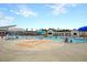 Large community pool area with lounge chairs, umbrellas, and a splash pad for  at 9676 Godwin St, Ladson, SC 29456