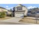 Charming two-story home with a two-car garage, a well-maintained lawn, and beautiful landscaping at 9676 Godwin St, Ladson, SC 29456