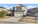 Charming two-story home featuring an attached garage and a well-maintained front lawn at 9676 Godwin St, Ladson, SC 29456