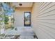 Inviting front entrance featuring a stylish door and manicured landscaping at 9676 Godwin St, Ladson, SC 29456