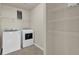 Laundry room featuring a washer and dryer set with shelving at 9676 Godwin St, Ladson, SC 29456