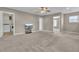 Living room with neutral carpet, a TV, and multiple entryways at 9676 Godwin St, Ladson, SC 29456