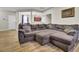 Spacious living room featuring a large couch and hardwood floors at 9676 Godwin St, Ladson, SC 29456